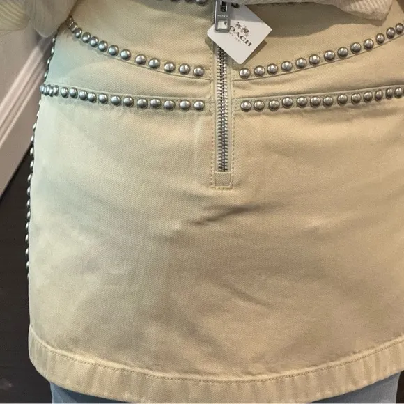 NWT Coach cream miniskirt with silver studs