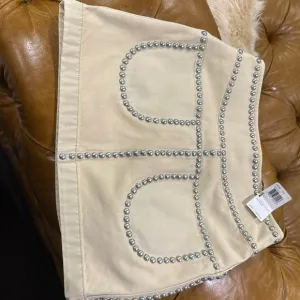NWT Coach cream miniskirt with silver studs