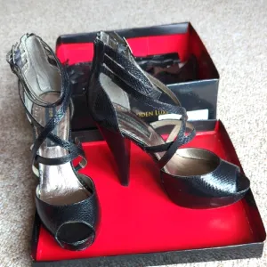 Steve Madden Luxe Black Heels with High Stiletto and Intricate Straps