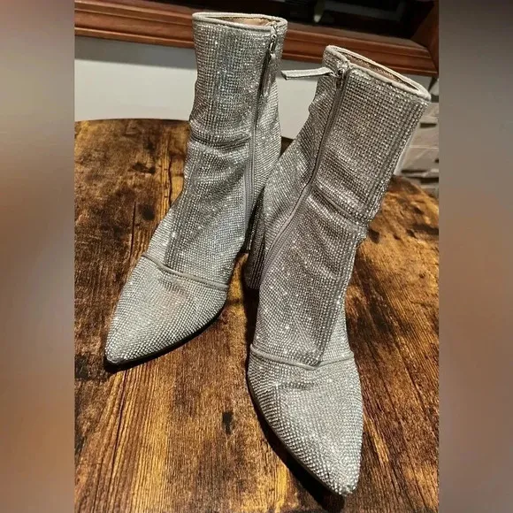 Steve Madden | NOTICED-R silver disco bootie. Size: 10.