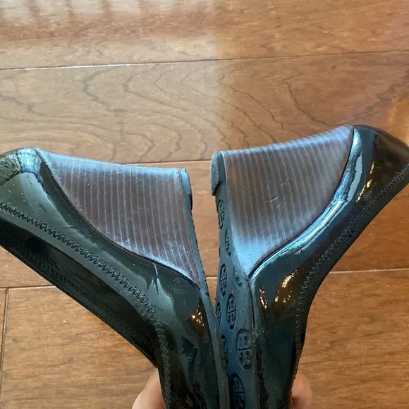 Tory Burch Black Patent Leather Logo Embellished Wedge Pumps.