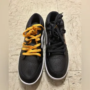 Yellow and black Jordan shoes